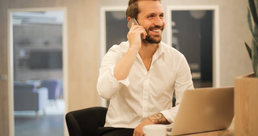 man using smartphone on chair